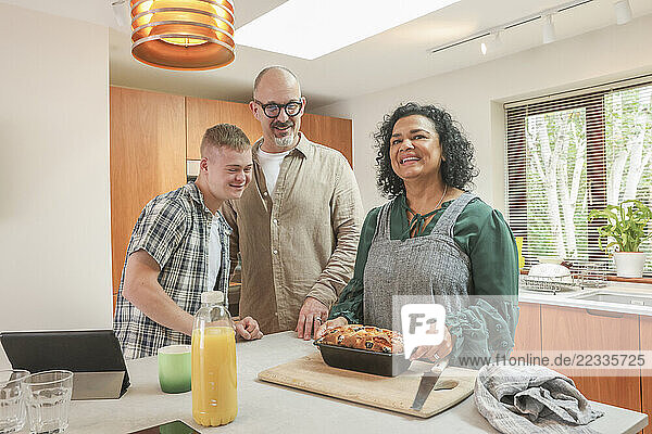 Family with adult son at in kitchen