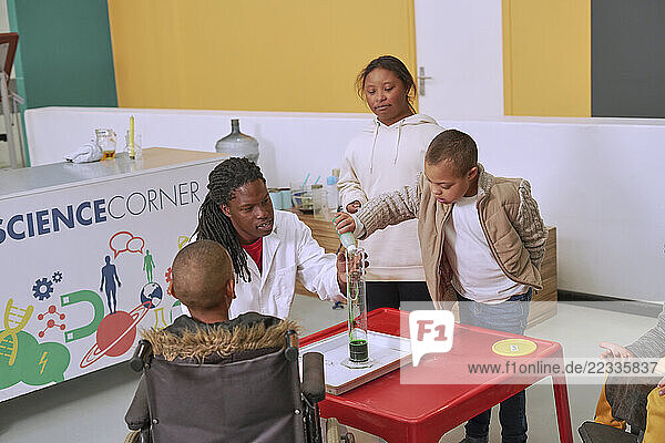 Kids participating in experiments in science center