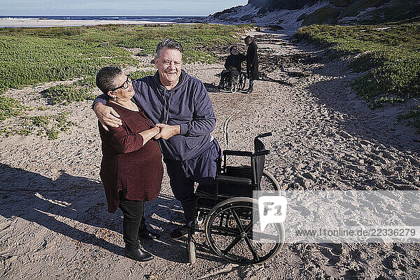 Group of disabled friends in landscape