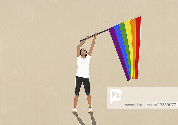 Woman waving rainbow pride flag on beige background