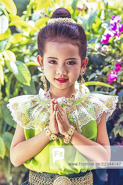 Young girl dressed for Loy Krathong festival in Bangkok; Bangkok  Thailand