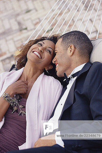 Couple in Formal Wear  Lying In Hammock