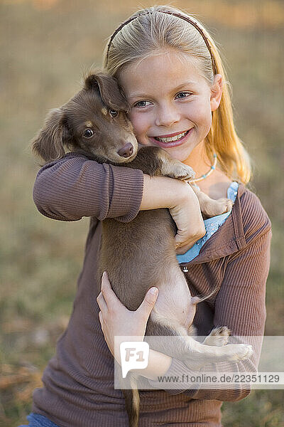 Girl Hugging Dog