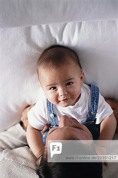 Father and Baby on Bed