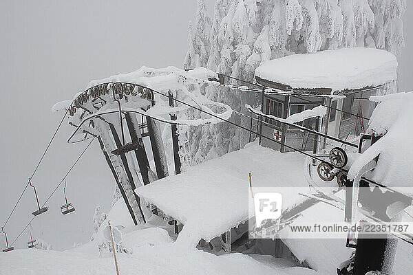 Snow-covered chairlift at a ski resort in Washington  USA; Stevens Pass  Washington  United States of America