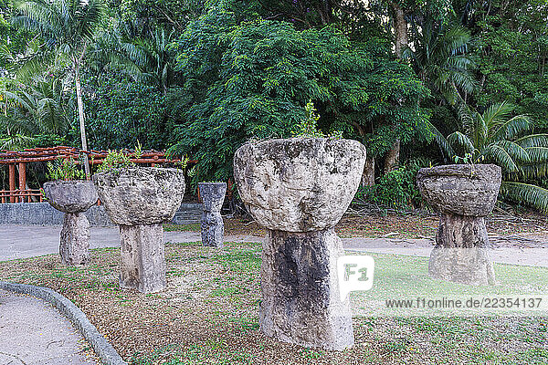 Ancient stone pillars in Latte Stone Park  Agana  Guam  Micronesia  Mariana Islands  Pacific Ocean. These latte stones were relocated in 1956 from the village of Mepo. Latte stones were used as the foundations for important structures from 1100-1700AD; Agana  Guam  Mariana Islands  Micronesia