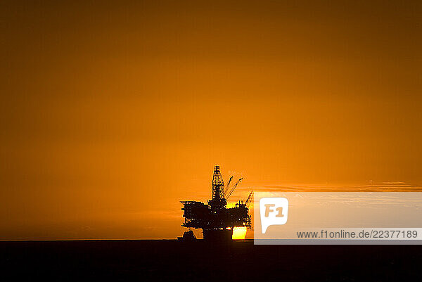 GULF OF MEXICO  LA - FEBRUARY 11: An oil platform is silohuetted against the setting sun in the Gulf of Mexico offshore of the Gulf states of the United States on February 11  2008. (Photo By Dan Rafla/Aurora)