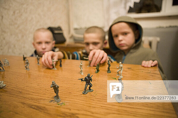 Krivoy Rog (Kryvyi Rih)  Ukraine - Children play with toy soldiers at Boarding School #9 during a visit from Canadian volunteers serving several orphanages throughout the Ukraine interior. Part of a documentary studying the Canadian-based Ukraine Orphan Mission; a project  now in its 10th year of operation  geared to share love and purpose through practical helps to orphans of the Ukraine.