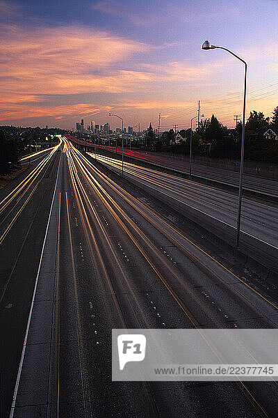 SEATTLE  WA - October  2000: Tail and headlights burn light trails along interstate 5 (I-5) towards Seattle in the early evening in October. Seattle is typical of the other cities in the northwest that see increasing urban growth often severely conjesting roadways. (Photo By Dan Rafla/Aurora).