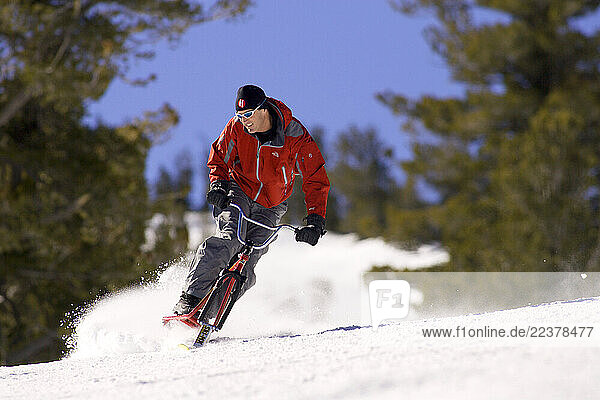 Matt Hanson shreds on a snow bike at Heavenly Mountain Resort in Lake Tahoe. Heavenly is unique in that it is the only resort in Lake Tahoe to offer runs on both the California and Nevada sides.
