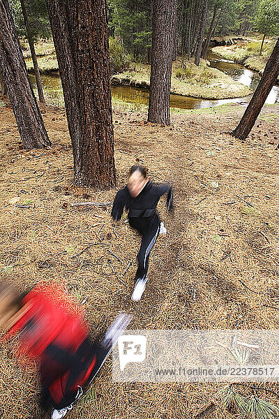 Andrew Brown and Silver Lumsdaine run near Trout Creek in South Lake Tahoe  CA May 2  2007.