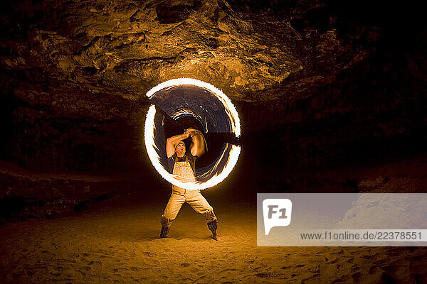 Kevin Thompson performs a fire dance in a cave in the Grand Canyon in Arizona.