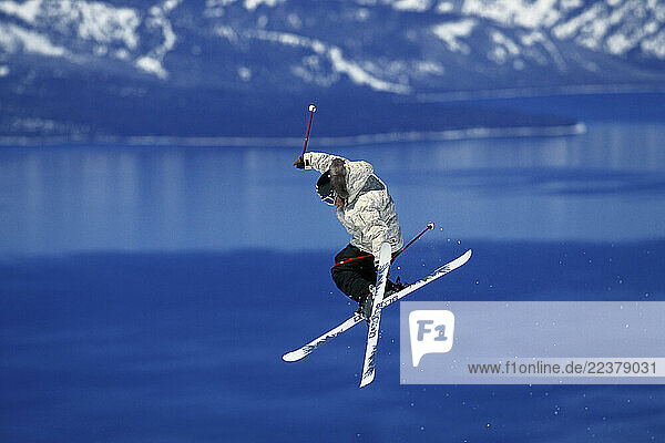Brent Abrams flying high above blue Lake Tahoe while skiing at Heavenly Mountain Resort in South Lake Tahoe  California.