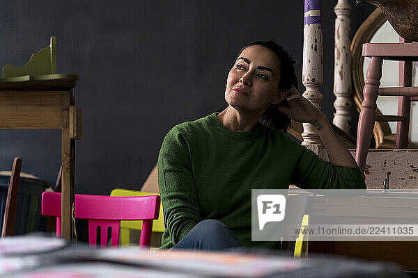 Small business owner in a creative workshop setting