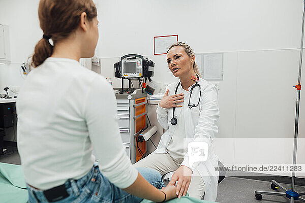 Doctor consulting with a patient in an emergency room setting