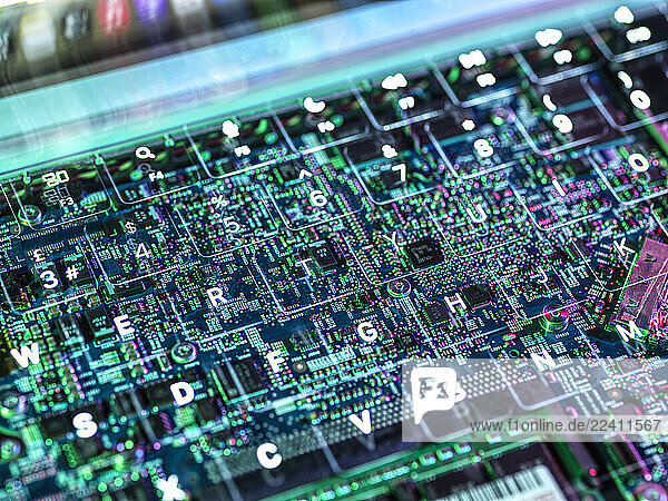 Abstract view of a circuit board overlay on a keyboard representing technology and artificial intelligence