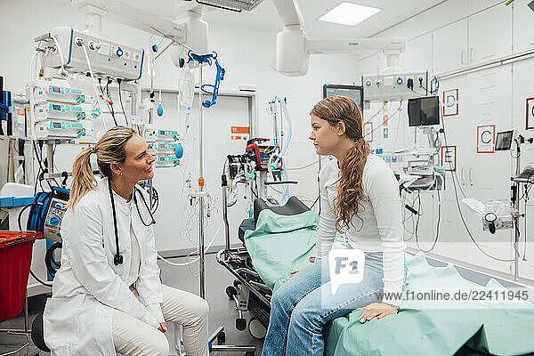 Doctor consulting with a patient in an emergency room setting