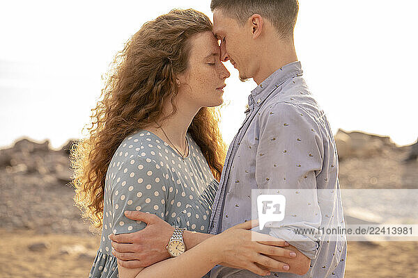 Portrait of young couple at the beach