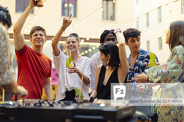 Happy multi-ethnic friends having fun during a party