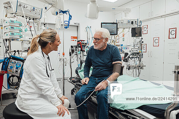 Doctor consulting with a patient in an emergency room setting