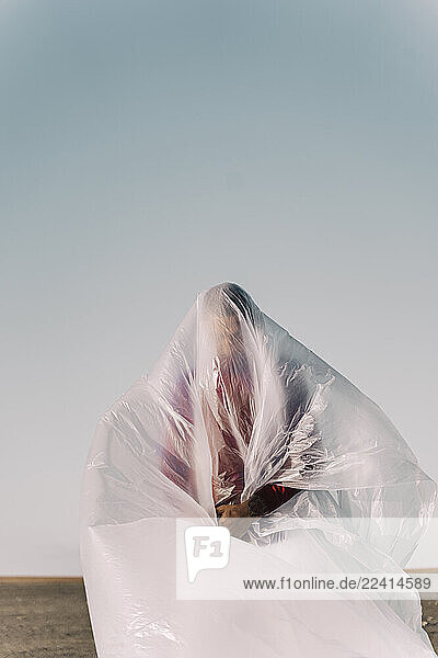 Man trapped in a plastic foil