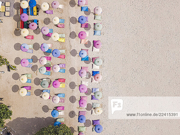 Indonesia  Bali  Nusa Dua  Aerial view of colorful umbrellas on resort beach