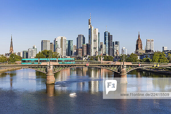 Ignatz Bubis Bridge over River Main in city against clear blue sky at Frankfurt  Germany