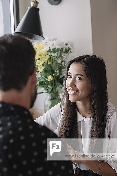 Young couple talking in a cafe
