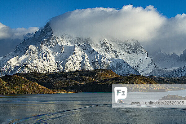 Boat heads across Lake Pehoe at Torres Del Paine