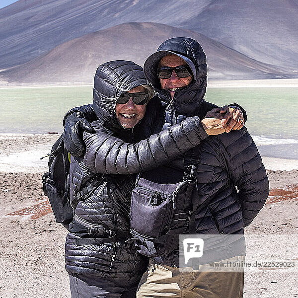 Portrait of smiling senior couple standing in Atacama Desert