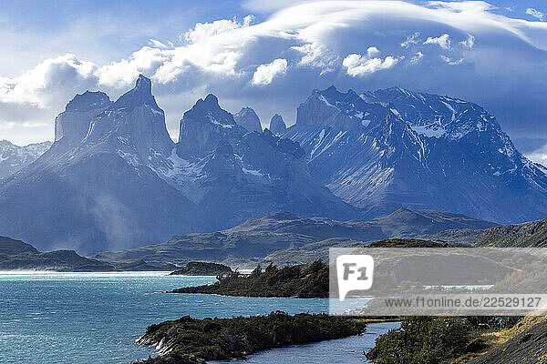 Clouds over Lake Pehoe and peaks of Torres Del Paine