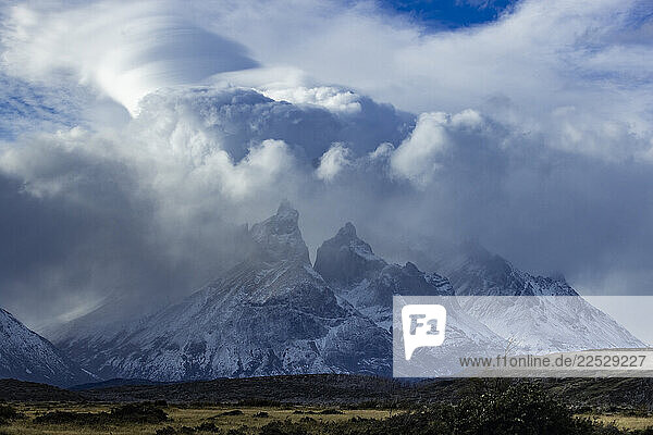 Clouds over snow covered peaks of Torres Del Paine