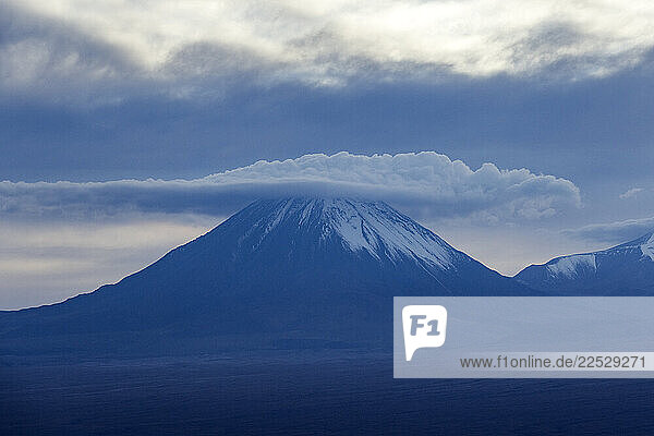 Clouds obscure crater of former volanos cinder cone