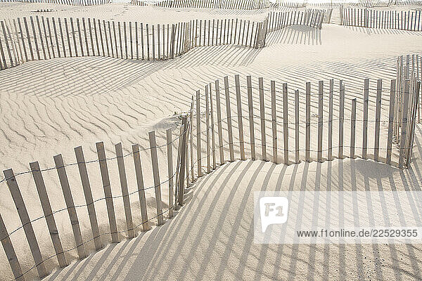 Fences and shadows on sand