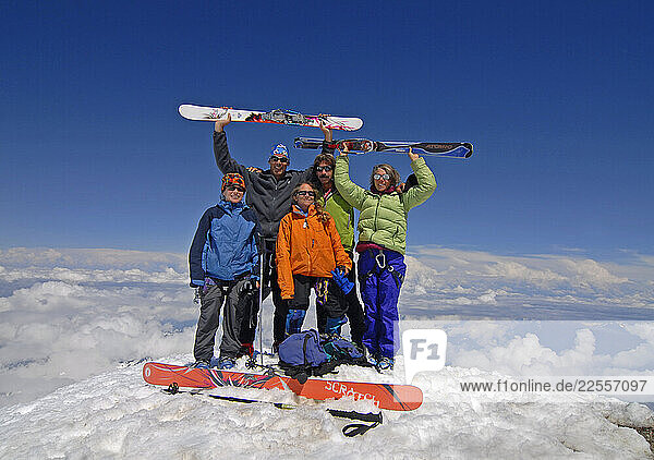 Liz Schermer  Julie Hirsch  Ann Brooking  Cliff Leight  and Klev Schoening  celebrate on the summit of 10 710 foot high Mt. Baker in the North Cascade Mountains of Washington State. They shortly donned their skis for a fantastic spring ski down the snowy slopes of one of Washington s spectacular volcanos.