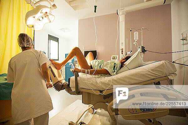 a woman waiting to give birth in the hospital delivery room Mom: Éléonore Dad Christophe  Lorient  Brittany  France.