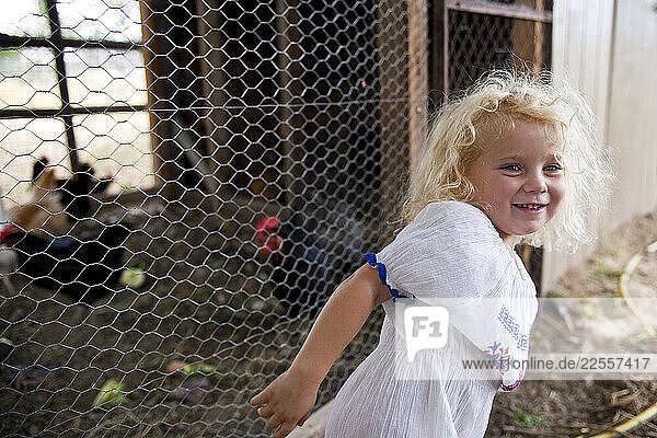 Anna Bell  three year old daughter of farm owners Dave and Jill Bell  proudly shows off the family s chicken coop at Bell Organic Gardens in Draper Utah.