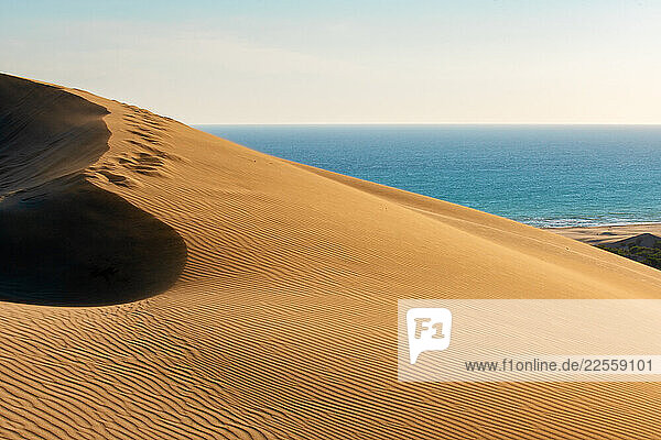 Footprints climbing a sand dune at Patara Beach