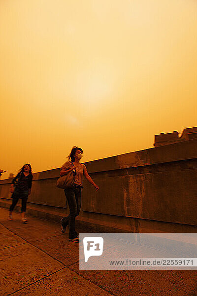 Apocalyptic vision of Sydney shrouded in red dust blown in by winds from the deserts of the outback.