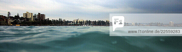 View from the surface of the water at a beach in Australia before a yacht race.