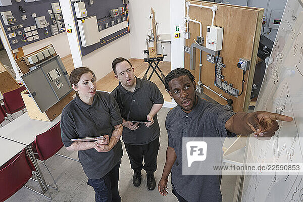 Disabled men and woman at workshop