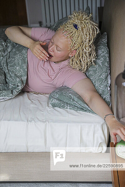 Woman waking up in bed