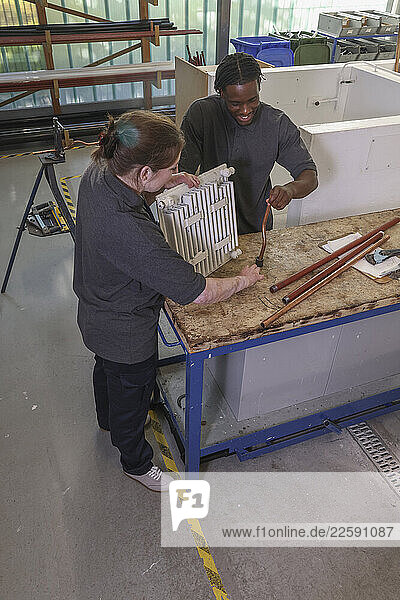 Disabled man and woman at workshop