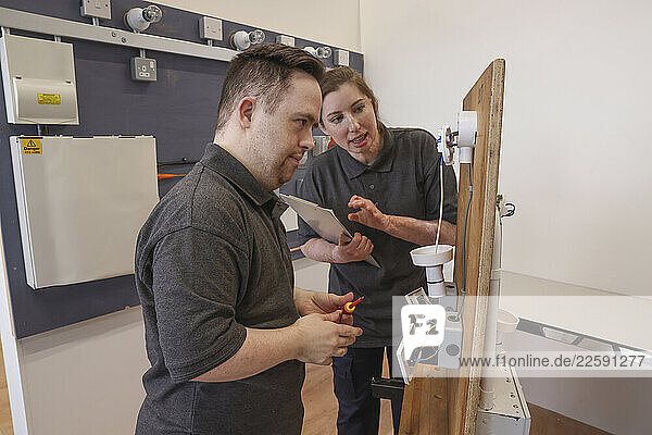 Disabled men and woman at workshop