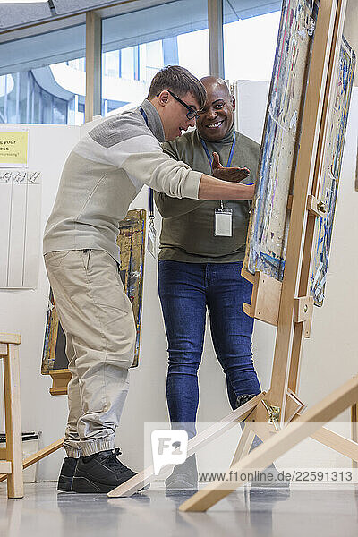 Disabled men painting in workshop