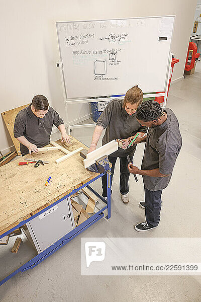 Disabled men and woman at workshop