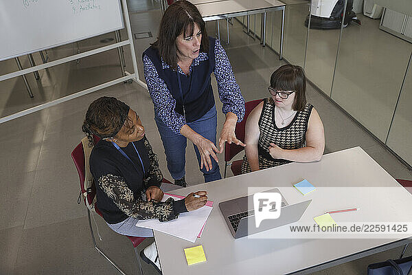 Coworkers having meeting in office