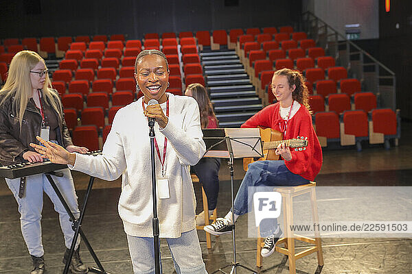 Persons with disabilities performing music on stage