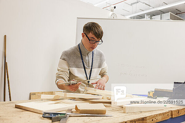 Man with Down Syndrome working in workshop