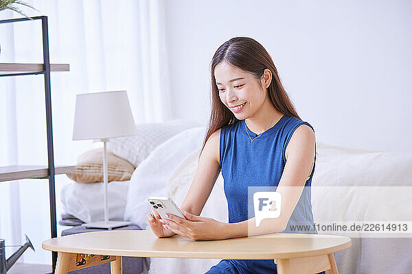 Young Japanese woman at home